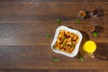 Morning breakfast, corn flakes, raisins, almonds, orange juice, top view, on a dark wooden background, flat lay. The concept of Royalty Free Stock Photo