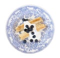 Morning breakfast with french crepes, fresh blueberry, yogurt on a plate isolated on white background.