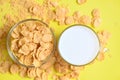 Morning breakfast fresh whole grain cereal, cornflakes with milk on yellow background, cornflakes bowl breakfast food and snack Royalty Free Stock Photo