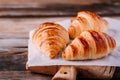 Homemade baked croissants on wooden rustic background Royalty Free Stock Photo