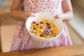 Morning breakfast, little girl hand holding cornflakes cereal, s Royalty Free Stock Photo