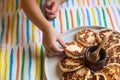 Morning breakfast. Little girl pulls a hand to a plate with chee Royalty Free Stock Photo