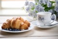 Morning Breakfast Rustic Still Life. Coffee Cup Croissant With Cream, Flower Decoration. Vintage Rural Sunny Light