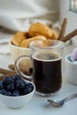 Morning Breakfast, small transparent mug of black coffee with sweets Royalty Free Stock Photo