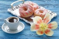 Morning breakfast with spring tulips and silk shawl on table