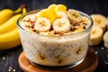 Morning breakfast table with healthy oatmeal, fresh bananas, and creamy yogurt in sunlight