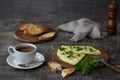 Morning breakfast of a traditional French omelet with toasts and butter, chopped parsley and a white porcelain cup of coffee on a Royalty Free Stock Photo