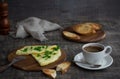 Morning breakfast of a traditional French omelet with toasts and butter, chopped parsley and a white porcelain cup of coffee on a Royalty Free Stock Photo