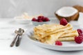 Morning, breakfast - traditional russian blini pancakes, french crepes served with fresh raspberries, coconut