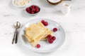 Morning, breakfast - traditional russian blini pancakes, french crepes served with fresh raspberries, coconut