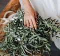 Morning of the bride with a bouquet of eucalyptus