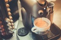 Closeup still life of espresso coffee maker machine with mug cups and capsule pods Royalty Free Stock Photo