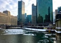 Morning in Chicago with interesting cloudscape over frozen Chicago River in winter. Royalty Free Stock Photo