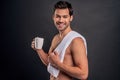 Morning chill out. Enjoying his cappuccino. Man drink coffee or tea. Mature man hold paper coffee cup stand by grey background. Royalty Free Stock Photo