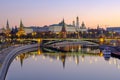 Morning city landscape with view on Moscow Kremlin and reflections in water of river Royalty Free Stock Photo