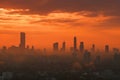 Morning city shrouded in smog, sunrise tainted by air pollution. Royalty Free Stock Photo