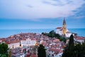 Morning cityscape of city of Piran, Slovenia with big dominant St. George`s Parish Church and main square