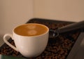 Morning, Close-up shots of coffee cup nice espresso put on coffee beans fragrant aroma. Royalty Free Stock Photo