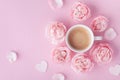 Morning coffee and beautiful rose flowers on pink pastel table top view. Cozy breakfast for Womens or Valentines day. Flat lay