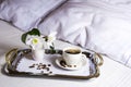 Morning coffee in bed on elegant silver tray Royalty Free Stock Photo