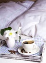 Morning coffee in bed on rustic wooden serving tray