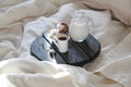 Morning coffee in bed and the sun`s rays Royalty Free Stock Photo