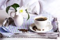 Morning coffee in bed with white lily flowers