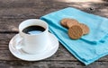 Morning coffee with biscuits on wood table