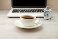 Morning coffee black hot espresso in white cup, saucer on wooden table, clock, notebook Royalty Free Stock Photo
