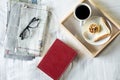 Morning coffee bread and book or newspaper on the bed. Royalty Free Stock Photo