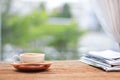 Morning coffee, Cup of coffee with newspapers, near the window.background in the morning sunlight. Royalty Free Stock Photo