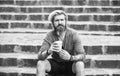 Morning coffee. man with cup outdoors. Handsome calm bearded man outdoors with coffee. drinking hot coffee. tourist