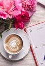 Morning coffee mug for breakfast, empty notebook, pencil and pink peony flowers Royalty Free Stock Photo