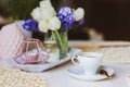 Morning coffee, spring decorations at home on the table in modern scandinavian style with flowers and aromatic candles Royalty Free Stock Photo