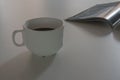 Morning coffee White cup on White wooden table. Royalty Free Stock Photo