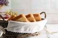 Toast bread in basket on white wooden table Royalty Free Stock Photo