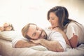 Morning conversation. Fun in bed. Royalty Free Stock Photo