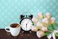 Morning cup of coffee and allarm Vector realistic. Tulip flowers bouquet and retro background. Spring summer season card Royalty Free Stock Photo