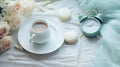 A morning cup of coffee, macaron cakes, and a nostalgic vintage alarm clock