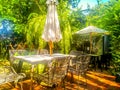 Morning Delight: Garden Table and Chairs with Umbrella in Soft Morning Light