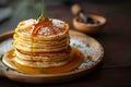 Morning delight Pancakes drizzled with honey on wooden surface