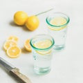 Morning detox lemon water in glasses, square crop