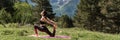 Morning Exercises in mountains landscape. Young Woman doing Yoga outdoor