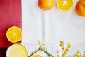 Morning flat lay with mimosa flower. Half of oranges, orange juice and mimosa flower. Top view Royalty Free Stock Photo