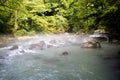 Morning fog above Mountain river in the middle of green forest Royalty Free Stock Photo