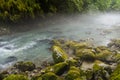 Morning fog above Mountain river in the middle of green forest Royalty Free Stock Photo