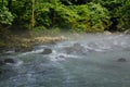 Morning fog above Mountain river in the middle of green forest Royalty Free Stock Photo