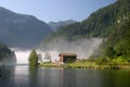 Morning fog lake KÃÂ¶nigssee in the german Alps Royalty Free Stock Photo