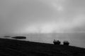 Morning fog on the Lena River, taiga of Siberia. Fishing boats on the riverbank in the misty dawn Royalty Free Stock Photo