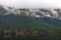 Morning fog in the mountains at Sproat lake in Vancouver Island Royalty Free Stock Photo